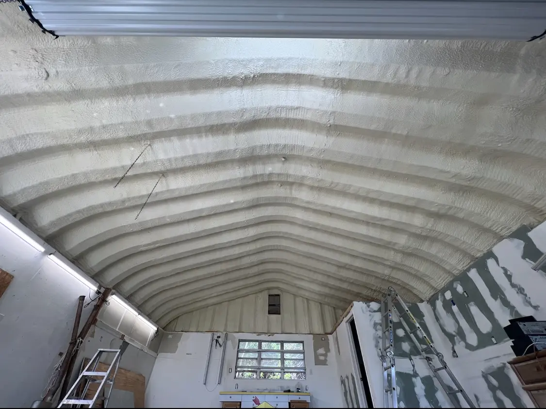 Spray polyurethane foam applied to the underside of a metal roof deck in Chatham